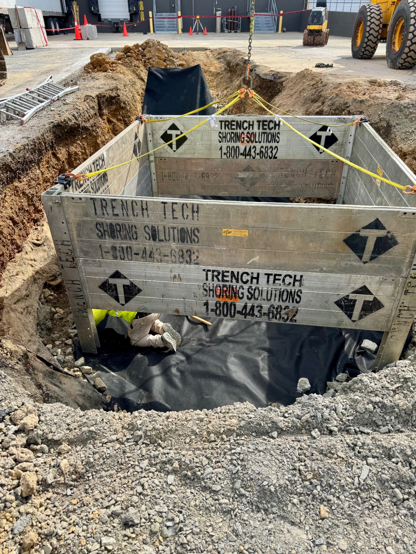 Protected trench box installed for underground utility work